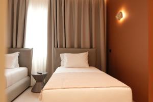 Postel nebo postele na pokoji v ubytování Hotel Natica