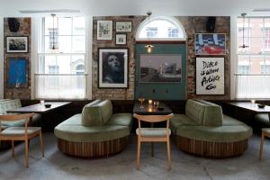 a restaurant with chairs and tables in a room at Artist Residence Bristol in Bristol