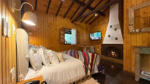 Μια τηλεόραση ή/και κέντρο ψυχαγωγίας στο Pousada Villa D'Amore