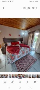 a bedroom with a bed with red sheets and a rug at Courtlyguesthouse in Witbank +82 photos