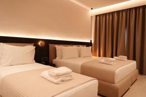 Postel nebo postele na pokoji v ubytování Hotel Natica