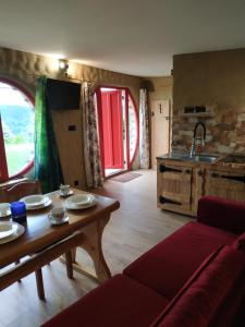 a living room with a table and a kitchen at Wilkowka in Wołkowyja +62 photos