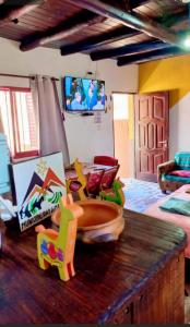 a room with a table with a toy bowl on it at Cabañas virgen de la candelaria in Maimará