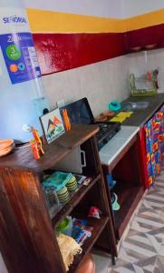 a kitchen with a stove and a counter top at Cabañas virgen de la candelaria in Maimará +9 photos