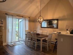 a kitchen and dining room with a table and chairs at Hope's Hideaway in Blakeslee