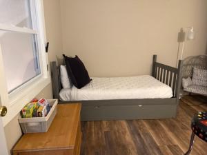 a small bedroom with a bed and a window at Hope's Hideaway in Blakeslee +12 photos