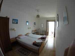 Postel nebo postele na pokoji v ubytování Aphrodite Hotel + 28 fotografií