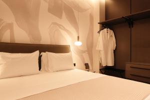 Postel nebo postele na pokoji v ubytování Hotel Natica