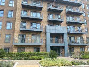 an apartment building with balconies on it at Sunny Gardens 3-Bed Apartment in London in Hendon