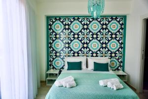 a bedroom with a bed with two towels on it at Casa Damico in Castelmola