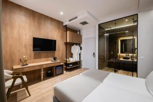 TV a/nebo společenská místnost v ubytování Mae Select Hotel