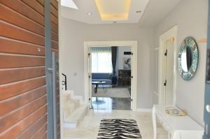 a hallway with a door leading to a living room at Villa Opera Kemer Müstakil Villa in Kemer