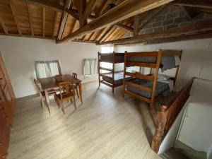 an overhead view of a room with a table and bunk beds at Casa na praia- Maia in Maia