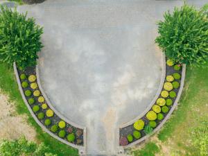 an overhead view of a garden with trees and flowers at Beautiful Estate in 19 acres of land in Apex in Apex
