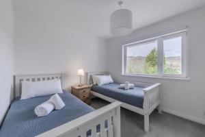 Postel nebo postele na pokoji v ubytování Heathercroft House-Modern 3 bedroom house with stunning views