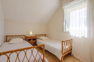 Postel nebo postele na pokoji v ubytování Les ancetres