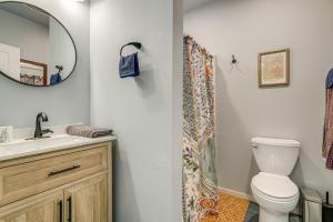 a bathroom with a toilet and a sink and a mirror at Less Than half Mi to OSU Studio in Corvallis Near Parks in Corvallis +16 photos