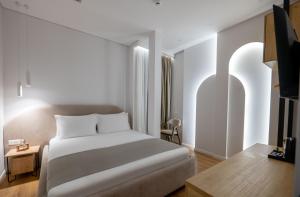 Postel nebo postele na pokoji v ubytování Mae Select Hotel