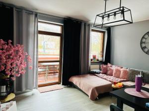 Posteľ alebo postele v izbe v ubytovaní Apartament SONIA