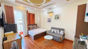a small bedroom with a bed and a chair at Helen Home in Ho Chi Minh City