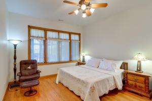 a bedroom with a bed and a ceiling fan at 366 Shared Acres, Lake Access: Ozark Getaway! in Fairfield Bay +33 photos