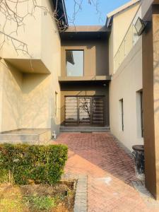 a house with a garage and a brick driveway at Tan Ridge Hill in Vosburg +8 photos