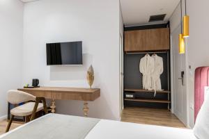 TV a/nebo společenská místnost v ubytování Mae Select Hotel