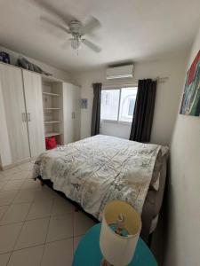 a bedroom with a bed and a ceiling fan at Habitación zen playa in Playa del Carmen