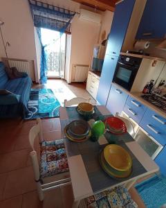 a kitchen with a table with plates on it at Il nido in collina Bertinoro in Bertinoro