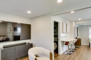 a living room with white walls and a white chair at 3 Blocks to Mtn Biking The Cottage in Crosby in Crosby