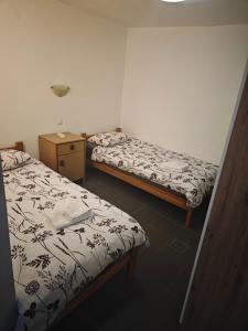 Postelja oz. postelje v sobi nastanitve Apartments INBOX