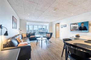 a living room with a couch and a table at 804-Hvide-Sande-Havnegade-2-1-A in Hvide Sande
