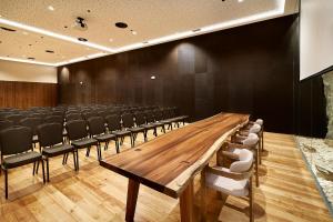 a conference room with a long wooden table and chairs at The Log Porto Hotel by Piamonte Hotels in Porto +38 photos