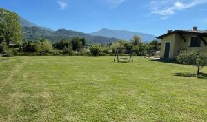 a large yard with a goal in the grass at La Paulonia Country House in Capezzano Pianore,