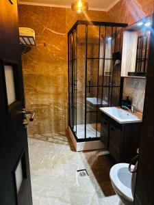 Vannituba majutusasutuses Nowad Hotel