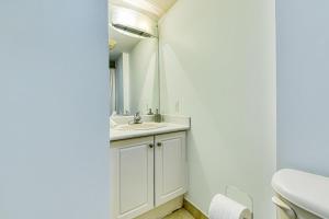 a bathroom with a sink and a mirror at RivetStays - The Pantages Suite in Toronto