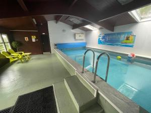 a swimming pool in a building with a swimming pool at The View in Ballantrae