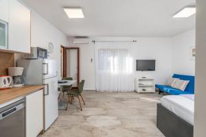 Kuchyň nebo kuchyňský kout v ubytování Apartment UGA