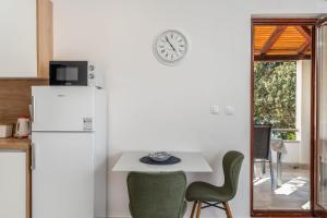 Kuchyň nebo kuchyňský kout v ubytování Apartment UGA