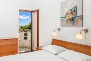 Postel nebo postele na pokoji v ubytování Apartment UGA