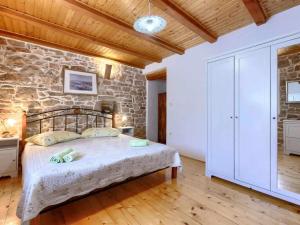 Ένα ή περισσότερα κρεβάτια σε δωμάτιο στο Holiday home DONADA +16 φωτογραφίες