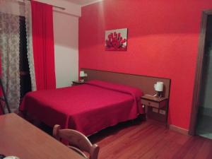 Postel nebo postele na pokoji v ubytování Hotel Turano
