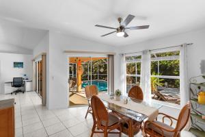 a kitchen and dining room with a table and chairs at Private Pool Home with Backyard Oasis & Family-Friendly Comfort in Cape Coral FL in Cape Coral