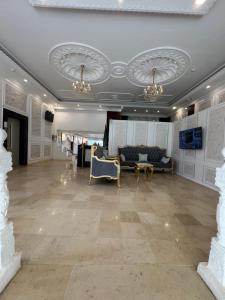 a large living room with a couch and chairs at فـالـي ريزيدنـس - Valley Residence in Al Baha