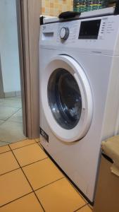 a white washing machine sitting in a room at Apartment Gaia in Nardò