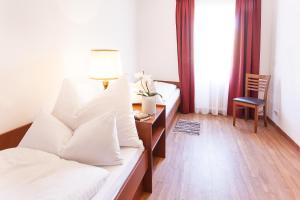 Łóżko lub łóżka w pokoju w obiekcie Appartements Steiner - SKI IN - SKI OUT