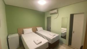 Postel nebo postele na pokoji v ubytování Domus Hotel Rio Verde - Parauapebas
