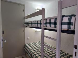 Un pat sau paturi într-o cameră la Le Hameau de la Nicolinière