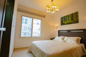 Katil atau katil-katil dalam bilik di Mahogany Suites by Skyreach Group