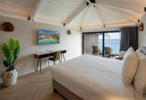 Un pat sau paturi într-o cameră la Curacao Avila Beach Hotel